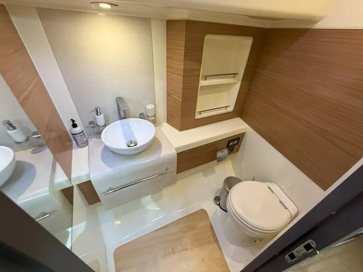 Ufo Yacht Photos Pics 2018 Chris-Craft Launch 38 bathroom with modern fixtures and wood accents.