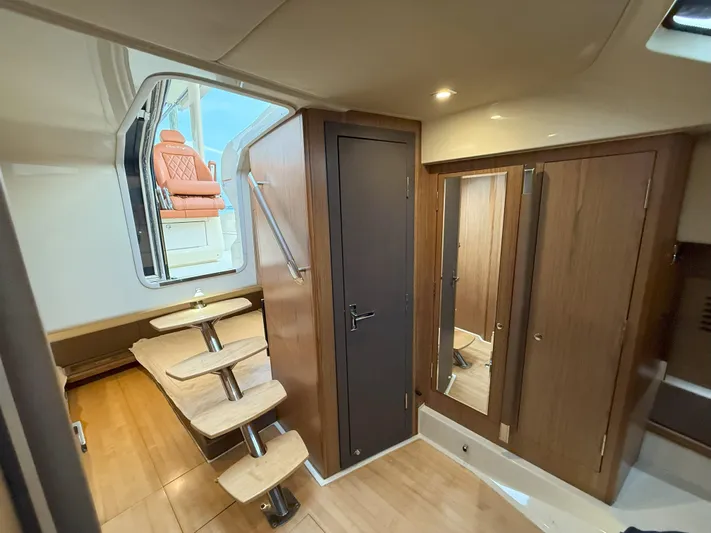 Ufo Yacht Photos Pics 2018 Chris-Craft Launch 38 interior with wooden stairs and modern cabinetry.