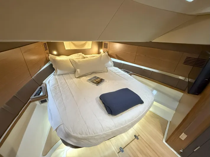 Ufo Yacht Photos Pics Luxurious cabin interior of 2018 Chris-Craft Launch 38 with cozy bed and modern design.
