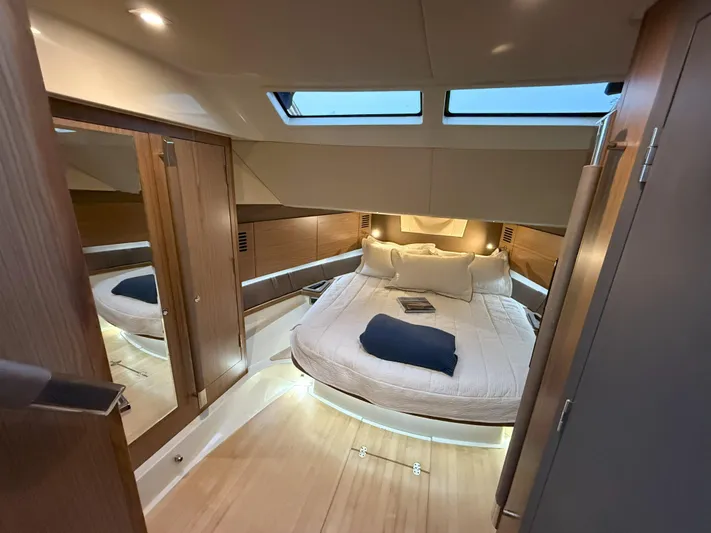 Ufo Yacht Photos Pics Luxurious cabin interior of 2018 Chris-Craft Launch 38 with elegant wood finishes.