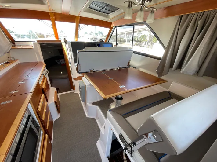  Yacht Photos Pics Interior of 2019 Cutwater C-302 Coupe, featuring dining area and modern amenities.