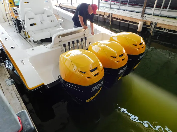 Fountain Repowered Yacht Photos Pics 2004 Fountain 38 Sportfish CC with triple 300 HP engines at dock.