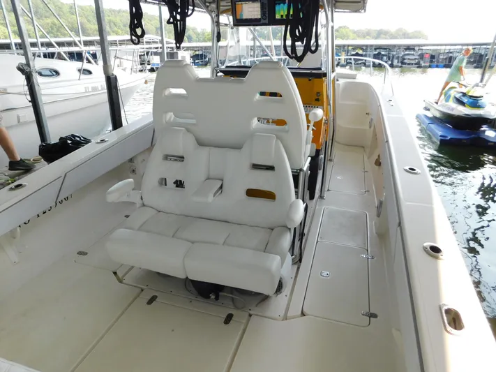 Fountain Repowered Yacht Photos Pics 2004 Fountain 38 Sportfish CC boat interior with white seating and control panel.