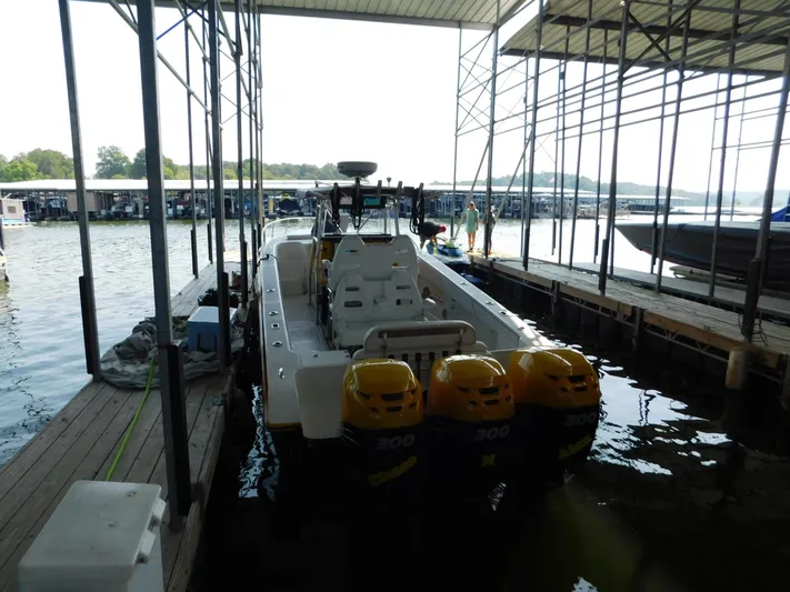 Fountain Repowered Yacht Photos Pics 2004 Fountain 38 Sportfish CC docked with triple outboard engines.