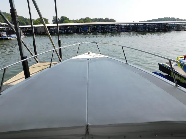 Fountain Repowered Yacht Photos Pics 2004 Fountain 38 Sportfish CC boat docked at a marina, view from the bow.