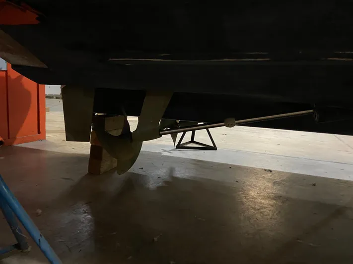 Lady June Yacht Photos Pics 2006 Four Winns 378 Vista boat propeller and shaft in a workshop setting.