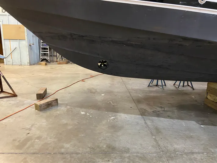 Lady June Yacht Photos Pics 2006 Four Winns 378 Vista boat hull in a workshop setting.