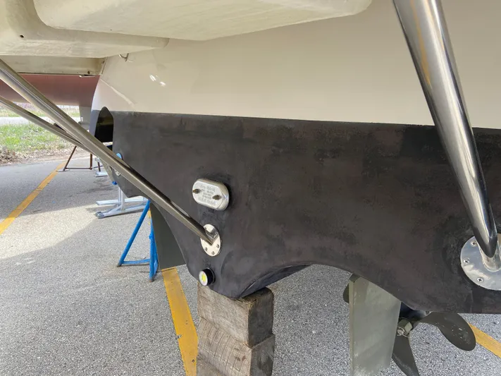 Lady June Yacht Photos Pics 2006 Four Winns 378 Vista boat hull with metal supports on a trailer.