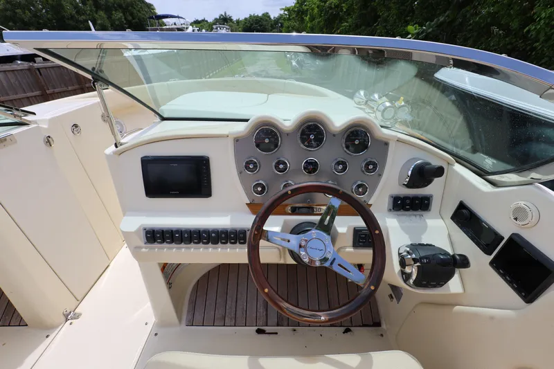  Yacht Photos Pics 2020 Chris-Craft 30 Launch boat dashboard with steering wheel and control panel.