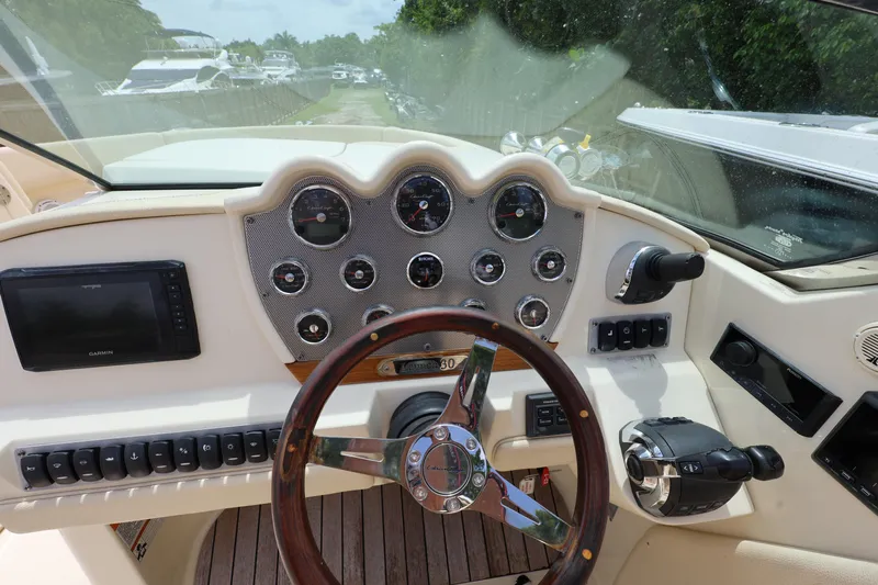  Yacht Photos Pics 2020 Chris-Craft 30 Launch dashboard with steering wheel and navigation controls.