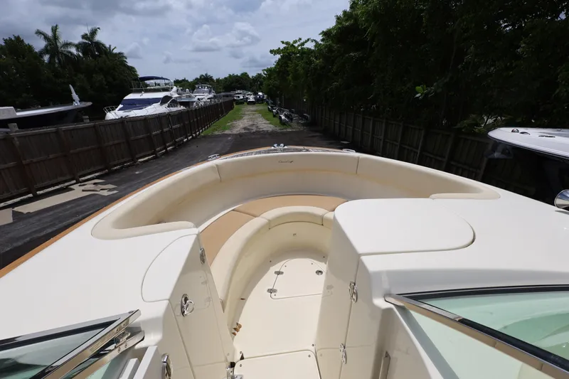  Yacht Photos Pics 2020 Chris-Craft 30 Launch boat with spacious seating, docked near other yachts.