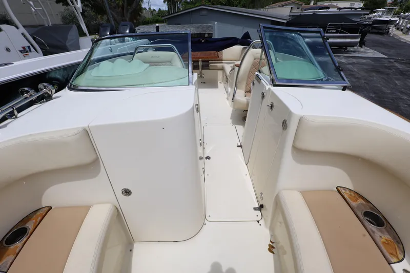  Yacht Photos Pics 2020 Chris-Craft 30 Launch boat interior with white and beige seating.