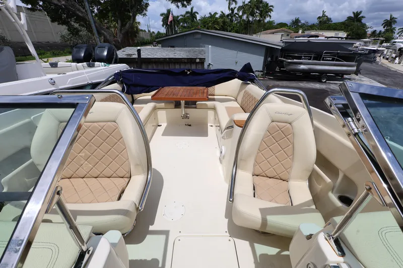  Yacht Photos Pics 2020 Chris-Craft 30 Launch boat interior with luxurious seating and wooden table.