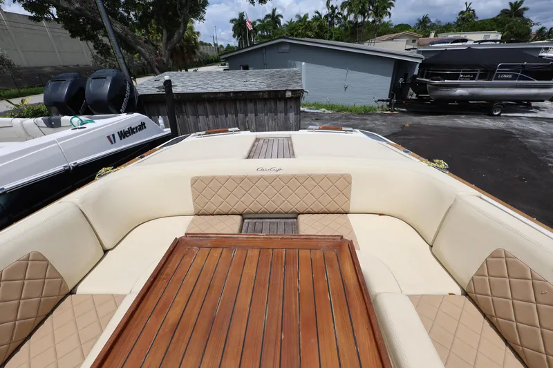  Yacht Photos Pics 2020 Chris-Craft 30 Launch boat with luxurious seating and wooden table.