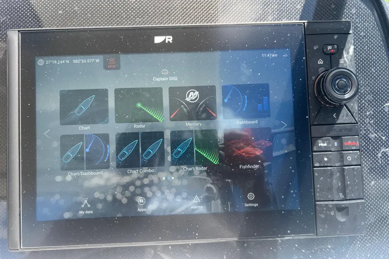  Yacht Photos Pics Touchscreen navigation system on 2025 Aquila 32 Sport boat displaying charts and radar.