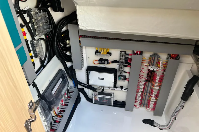  Yacht Photos Pics Electrical system of 2025 Aquila 32 Sport boat, showcasing wiring and components.
