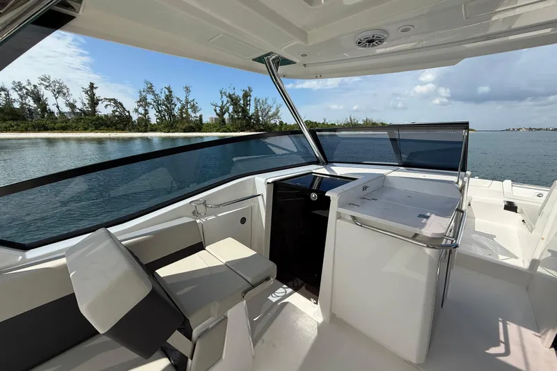  Yacht Photos Pics 2025 Aquila 32 Sport boat interior with sleek design and waterfront view.
