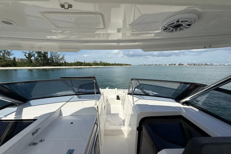  Yacht Photos Pics 2025 Aquila 32 Sport boat interior with ocean view and clear skies.