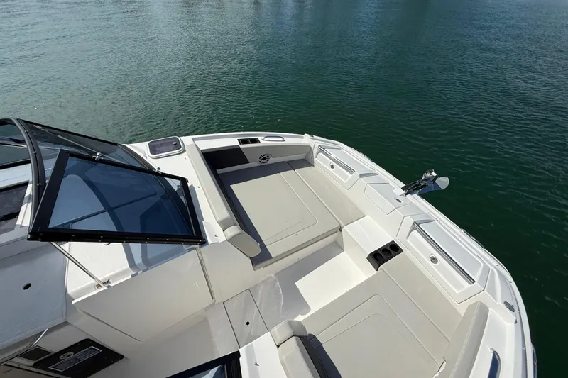  Yacht Photos Pics Aquila 32 Sport 2025 boat deck with seating, on calm water.