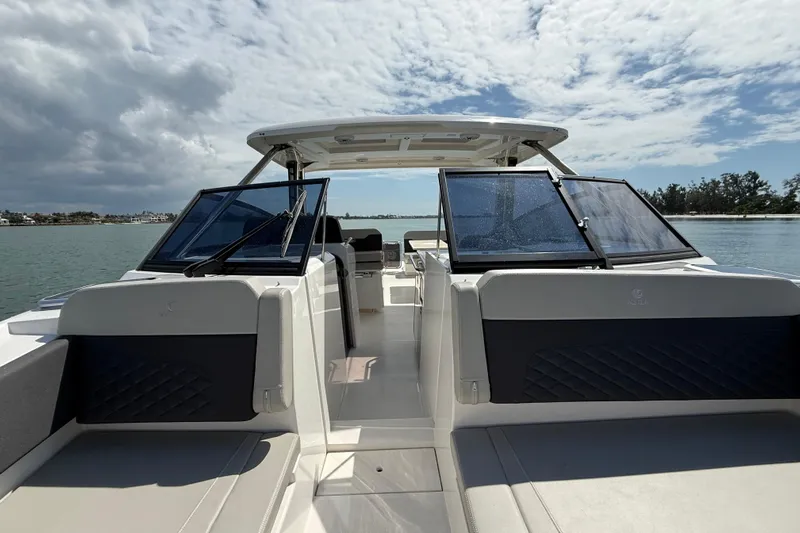  Yacht Photos Pics Aquila 32 Sport 2025 boat on water, featuring sleek design and spacious seating.