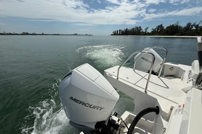  Yacht Photos Pics Aquila 32 Sport 2025 boat with Mercury engines cruising on a sunny day.