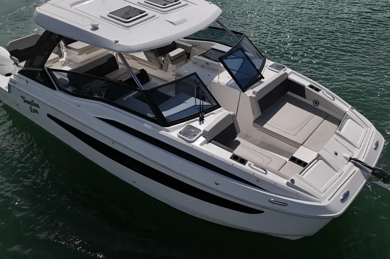  Yacht Photos Pics 2025 Aquila 32 Sport boat on water, featuring sleek design and spacious deck.