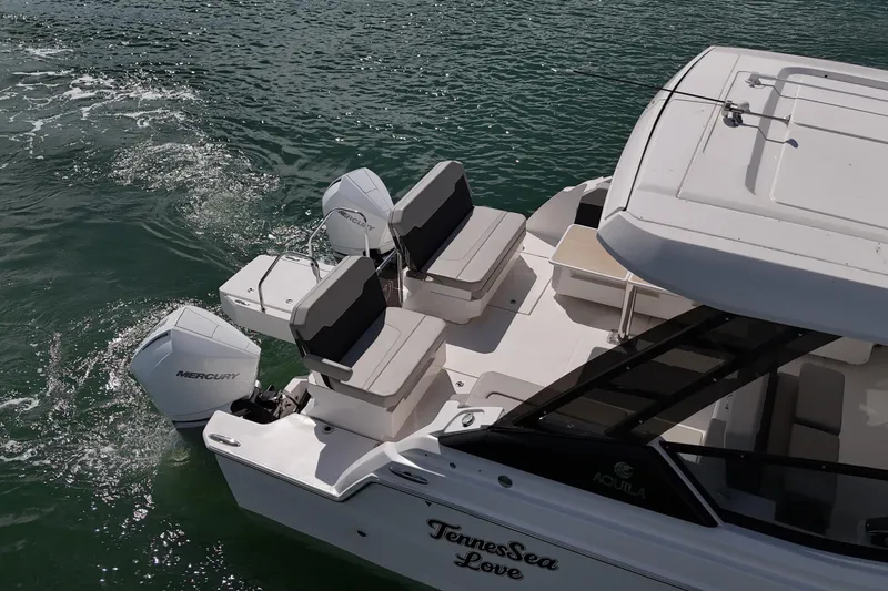  Yacht Photos Pics Aquila 32 Sport 2025 boat with Mercury engines on water.