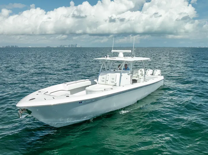  Yacht Photos Pics 2025 Contender 44 ST boat on open ocean under cloudy sky.