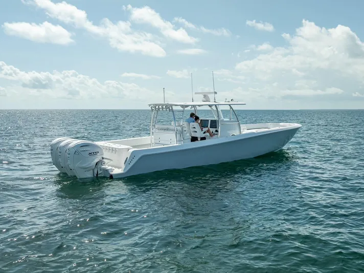  Yacht Photos Pics 2025 Contender 44 ST boat on open water under a clear sky.