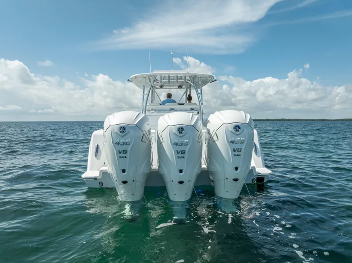  Yacht Photos Pics 2025 Contender 44 ST boat with triple V8 engines on open water.