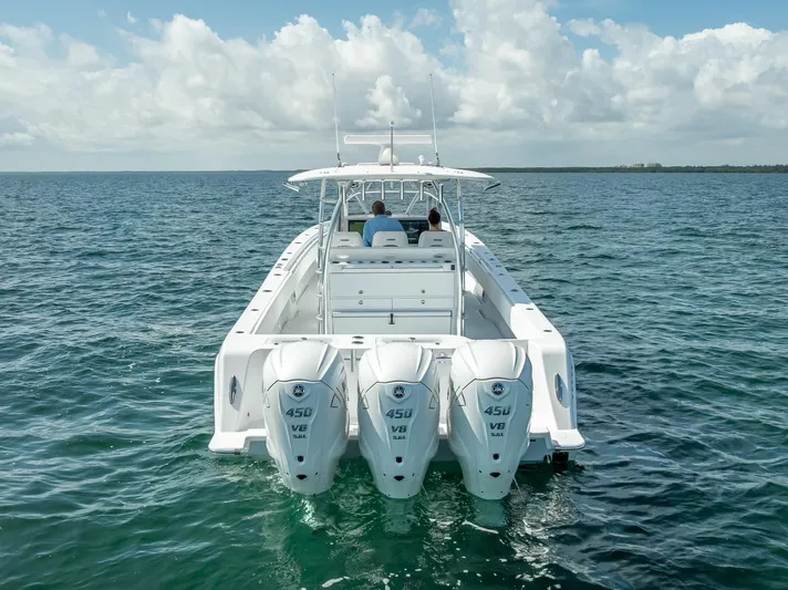  Yacht Photos Pics 2025 Contender 44 ST boat with triple 450 V8 engines on open water.