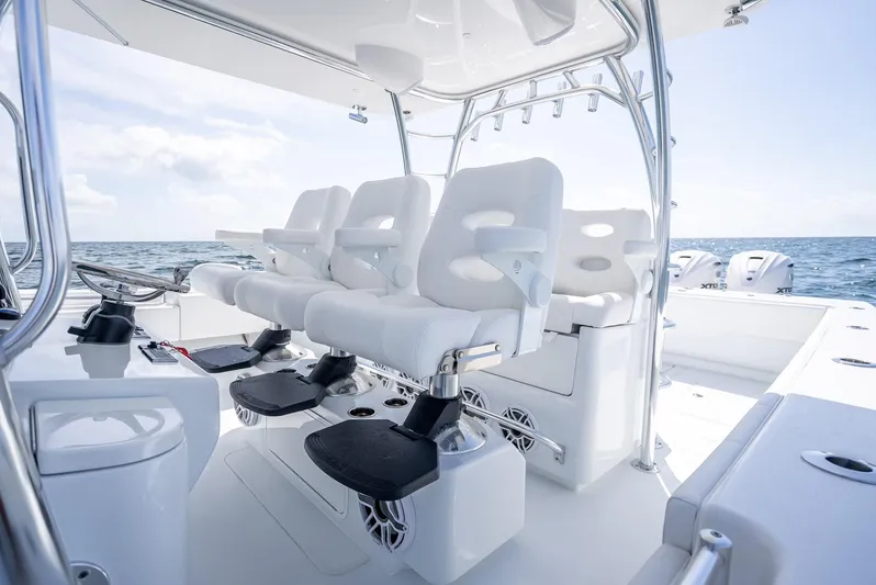  Yacht Photos Pics Luxury seating on 2025 Contender 44 ST boat, ocean backdrop, modern design.