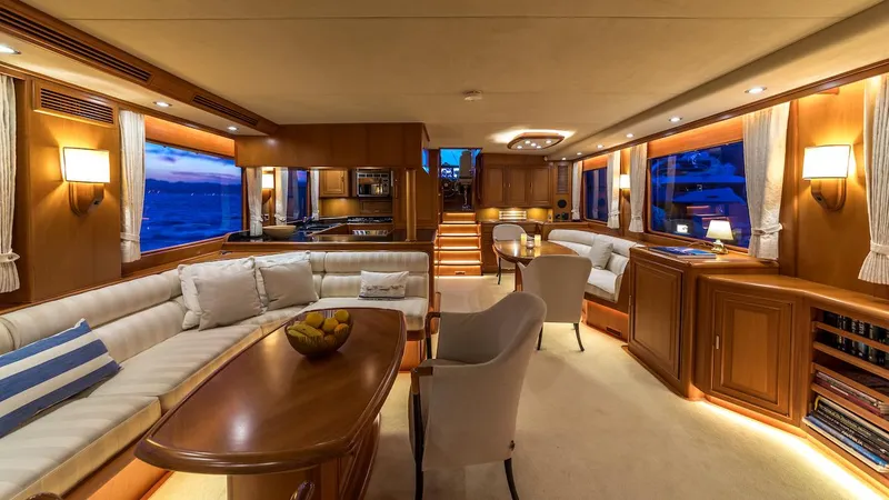 Perseus Yacht Photos Pics Luxurious interior of a 2004 Fleming 75 yacht with elegant wood finishes and ambient lighting.