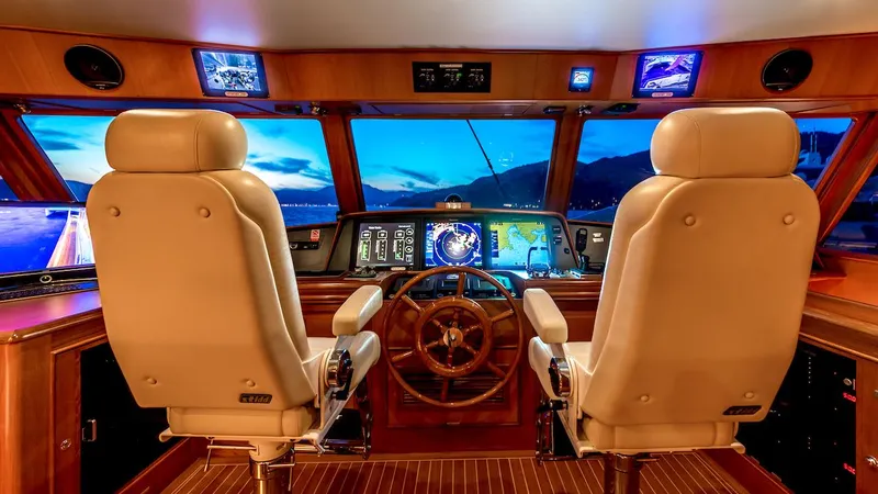 Perseus Yacht Photos Pics Luxurious 2004 Fleming 75 yacht cockpit with dual captain chairs and advanced navigation systems.