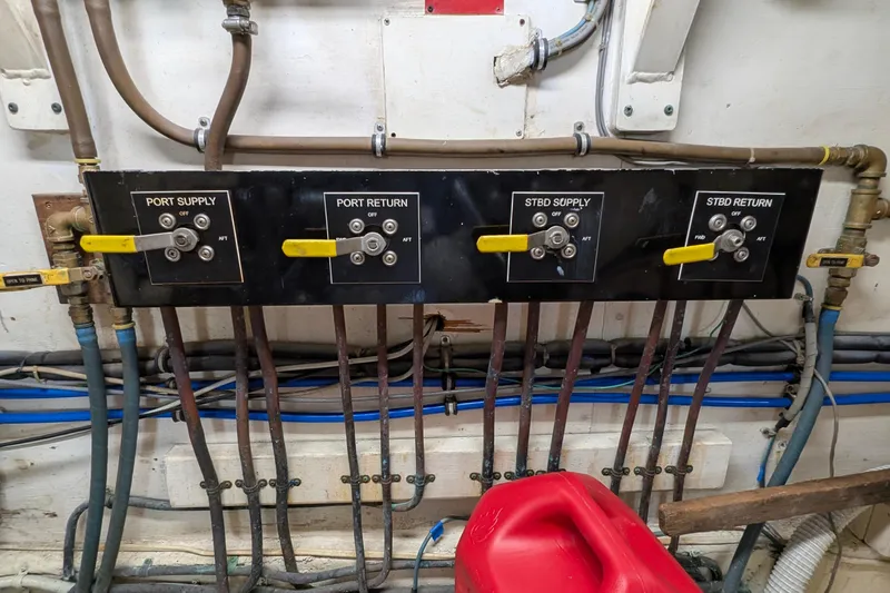 Mas Fina Yacht Photos Pics Control panel with labeled valves on a 1987 Hatteras Convertible boat.