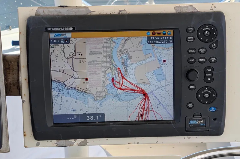 Mas Fina Yacht Photos Pics Navigation system on 1987 Hatteras Convertible displaying nautical chart and route.