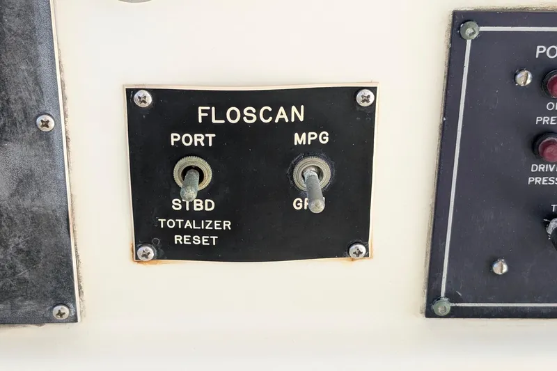 Mas Fina Yacht Photos Pics Control panel of a 1987 Hatteras Convertible boat with Floscan switches.