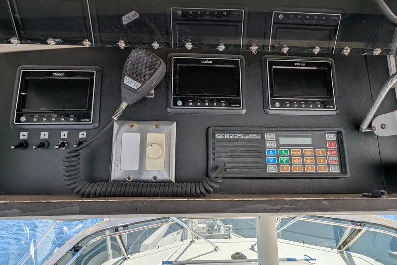 Mas Fina Yacht Photos Pics Control panel of a 1987 Hatteras Convertible boat with Clarion displays and SEA 225 radio.