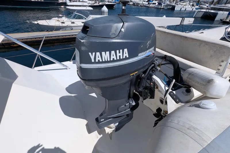 Mas Fina Yacht Photos Pics Outboard Yamaha motor on 1987 Hatteras Convertible boat at marina.