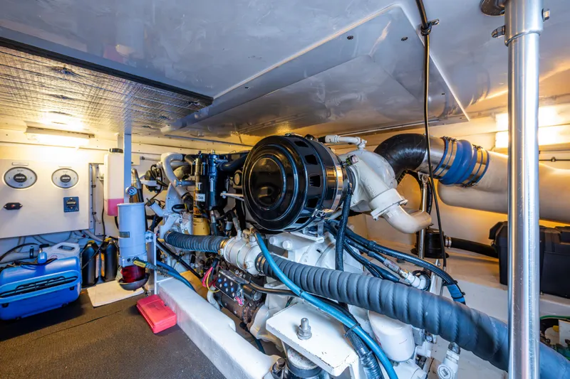 Miss Elena*eous Yacht Photos Pics Engine room of 2004 Egg Harbor 43 Sport Fisherman, showcasing detailed machinery and components.