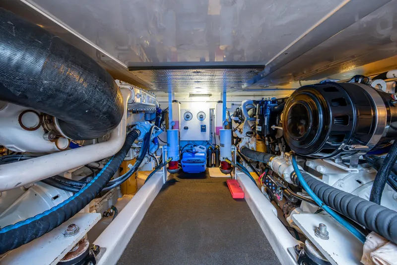 Miss Elena*eous Yacht Photos Pics Engine room of 2004 Egg Harbor 43 Sport Fisherman, showcasing mechanical components and systems.