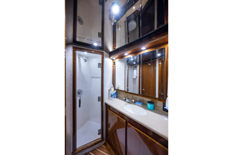 Miss Elena*eous Yacht Photos Pics Luxurious bathroom in 2004 Egg Harbor 43 Sport Fisherman yacht with shower and vanity.