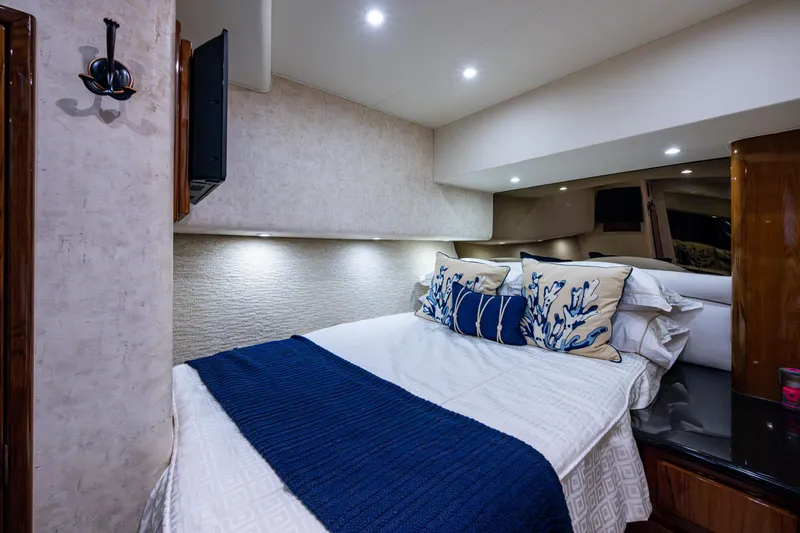 Miss Elena*eous Yacht Photos Pics Luxurious bedroom interior of 2004 Egg Harbor 43 Sport Fisherman yacht with elegant bedding.