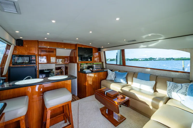 Miss Elena*eous Yacht Photos Pics Luxurious interior of 2004 Egg Harbor 43 Sport Fisherman yacht with elegant seating and modern amenities.