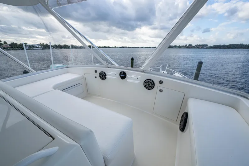Miss Elena*eous Yacht Photos Pics 2004 Egg Harbor 43 Sport Fisherman boat interior with white seating and water view.