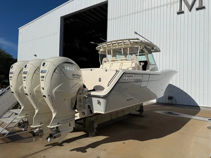  Yacht Photos Pics 2026 Grady-White Canyon 386 with Yamaha engines outside a warehouse.
