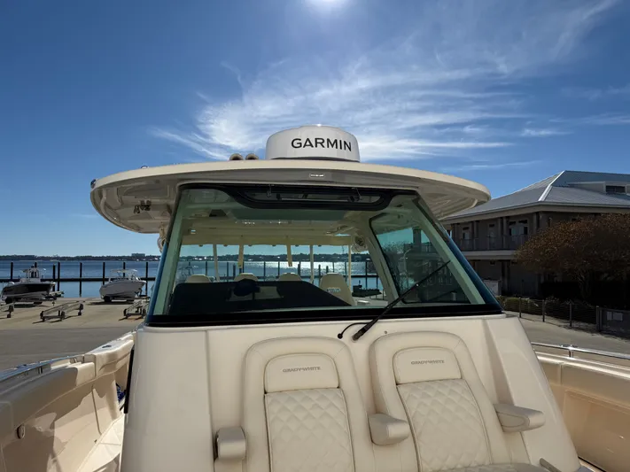  Yacht Photos Pics Grady-White Canyon 386 boat, 2026 model, docked under sunny skies.