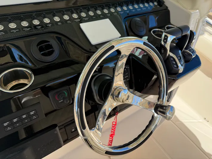  Yacht Photos Pics 2026 Grady-White Canyon 386 helm with chrome steering wheel.