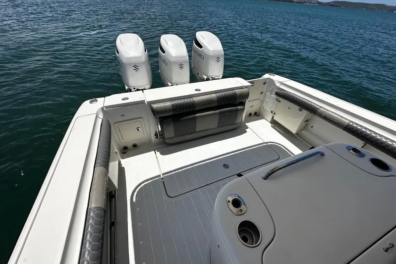  Yacht Photos Pics 2006 Hydra-Sports Vector 3300 VX boat deck with triple outboard engines on water.