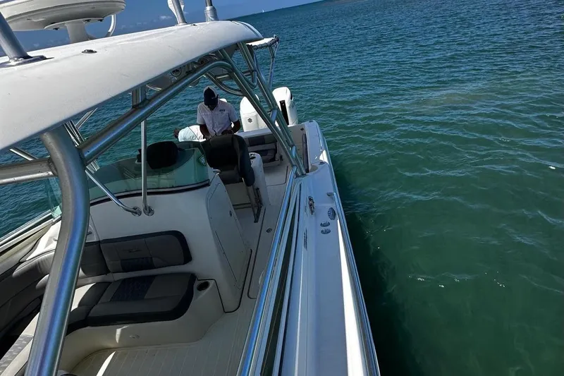  Yacht Photos Pics 2006 Hydra-Sports Vector 3300 VX boat on open water, featuring sleek design and spacious deck.